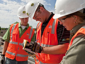 PCL employees on a jobsite in PPE (Personal Protective Equipment).